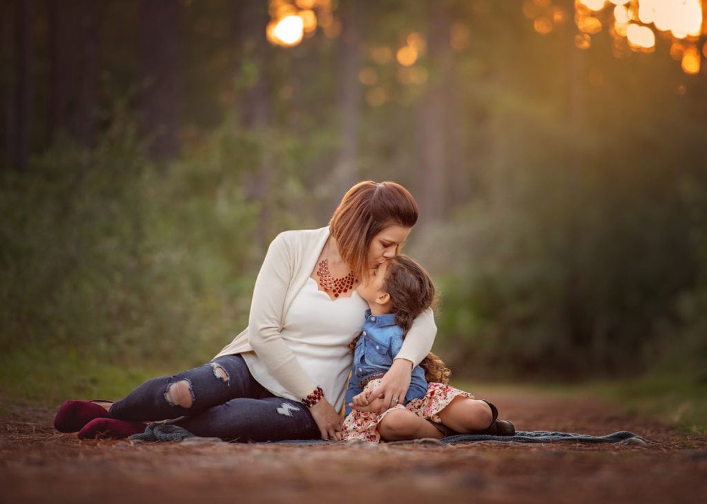Mother kissing daughter | Sasso Guerrero & Henderlite are expert Child Support Lawyers in Fernandina Beach, FL